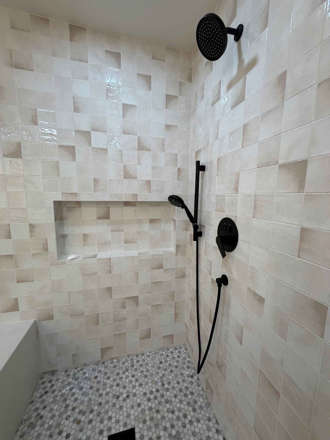 Walk-in shower tile installation — large-format porcelain, Sarasota Building Co.